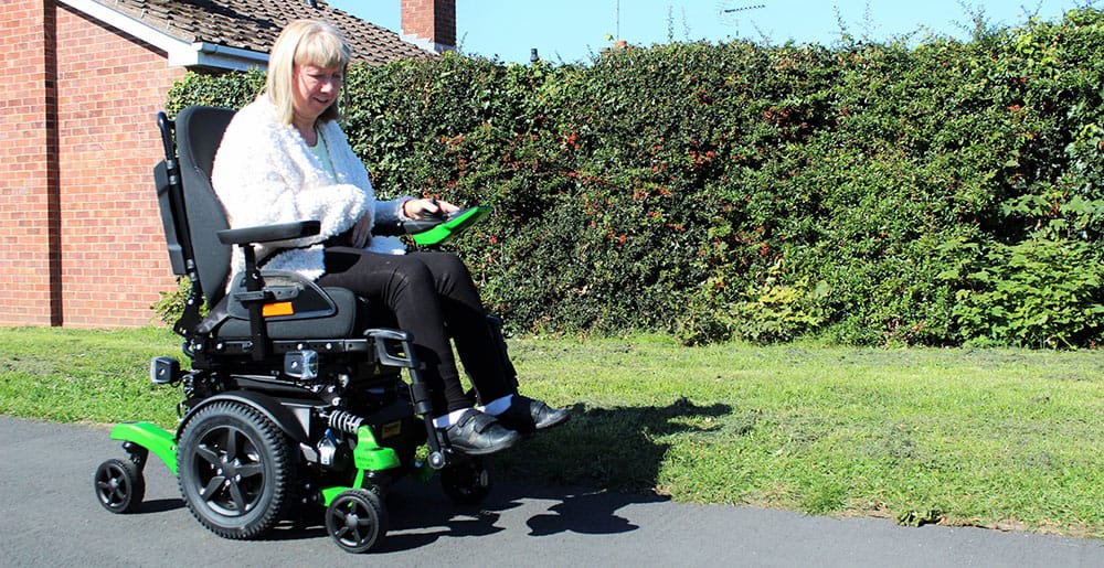 Karen Danks with Ottobock Juvo mid-wheel drive powerchair image