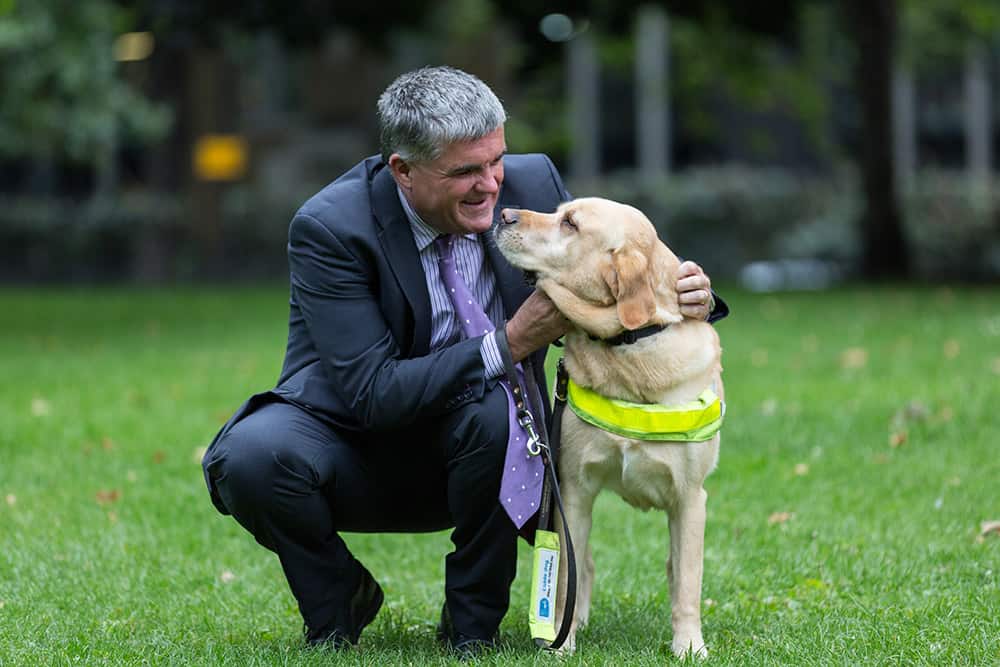 Neil Heslop OBE with his guide dog Storm image